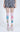 Person wearing checkered shorts and colorful tights with cartoon character design on a white background